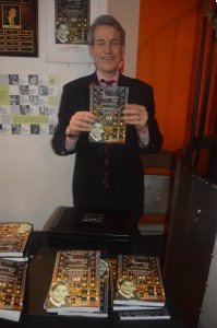 Writer Michael Colby with copies his memoir, “The Algonquin Kid” (Photos by Maryann Lopinto)