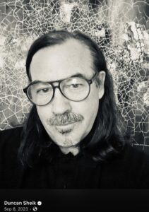 Black-and-white portrait of composer Duncan Sheik in dark-rimmed glasses ```  Title ``` Duncan Sheik ```  Caption ``` Duncan Sheik (1969–2026) ```  Description ``` Duncan Sheik, Tony Award-winning composer of Spring Awakening, who died September 17, 2026, at 56. ```  The image looks like a screenshot. If you know where it came from, add a photo credit to the caption, for example "Duncan Sheik (1969–2026)