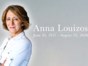 Alt Text: ``` Scenic designer Anna Louizos in a white shirt, with her name and the dates June 24, 1957 – August 25, 2026