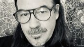 Black-and-white portrait of composer Duncan Sheik in dark-rimmed glasses ``` Title ``` Duncan Sheik ``` Caption ``` Duncan Sheik (1969–2026) ``` Description ``` Duncan Sheik, Tony Award-winning composer of Spring Awakening, who died September 17, 2026, at 56. ``` The image looks like a screenshot. If you know where it came from, add a photo credit to the caption, for example "Duncan Sheik (1969–2026)