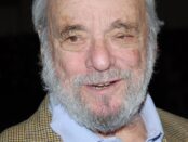 Stephen Sondheim, white-bearded and smiling, in a tweed jacket over a blue open-collar shirt